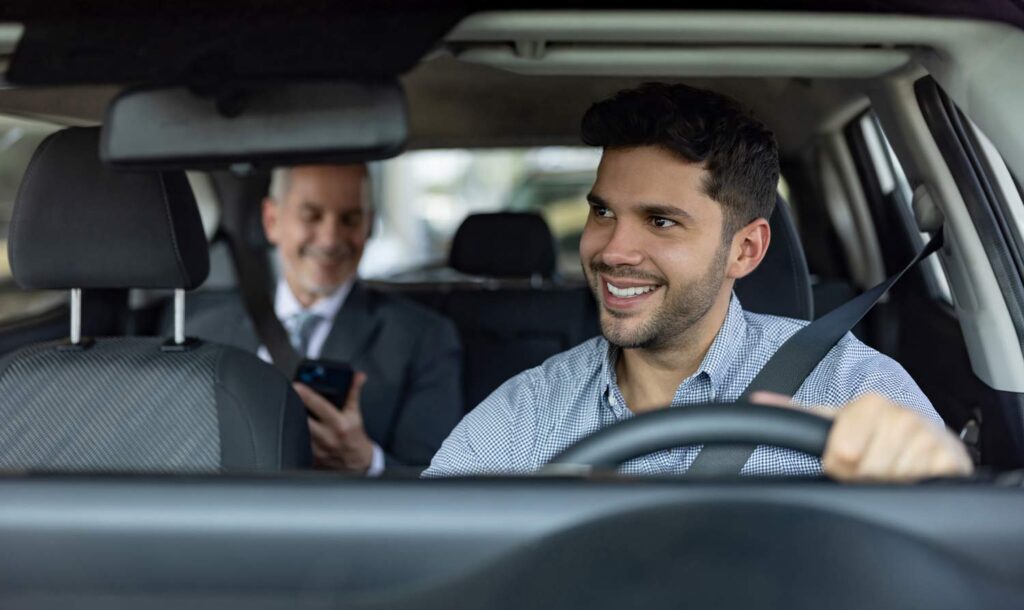 driver and passengers in a vehicle