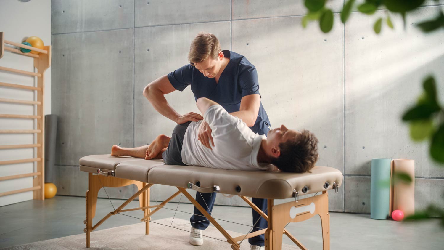 a physical therapist working on a patient