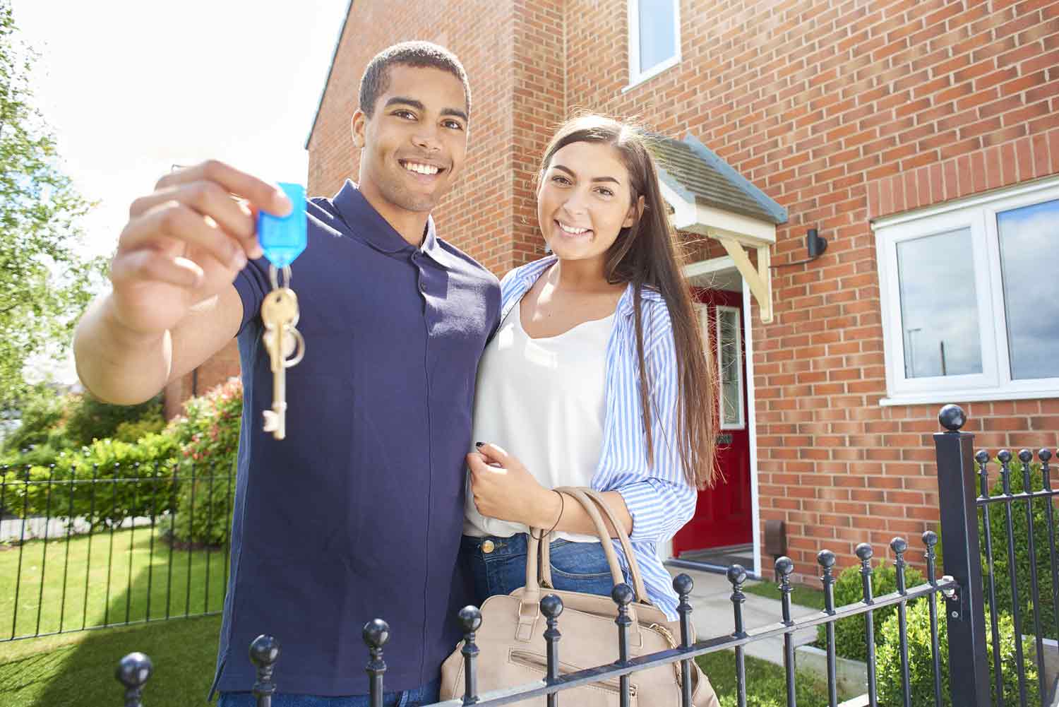 renters holding keys to an apartment