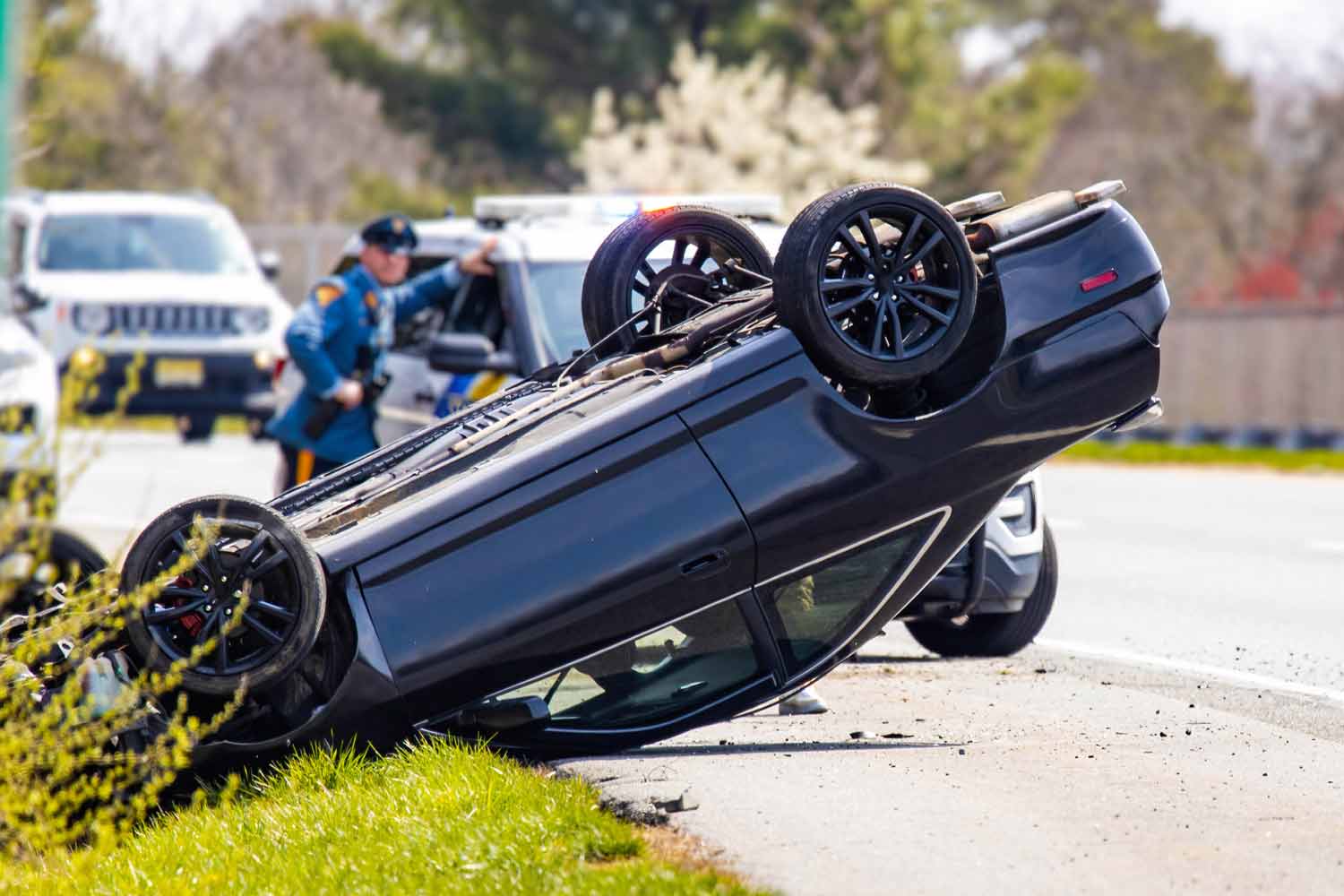 car on its roof after a crash